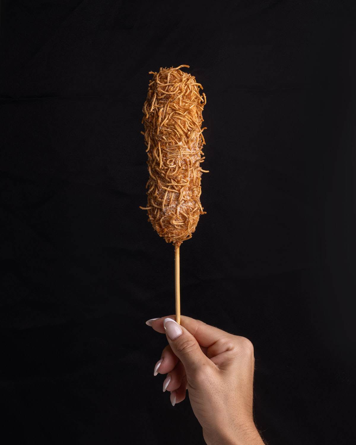 Korndog Noodle Crunch rebozado de ramen y panko